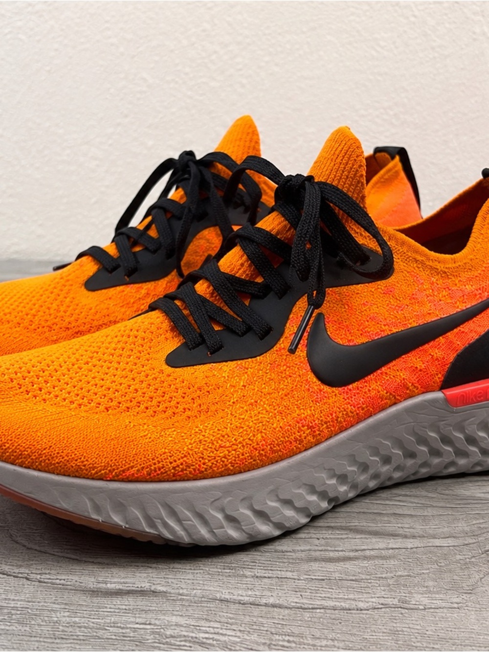 Nike Bright Orange Flyknit Sneakers with Black Accents Women’s Size 10